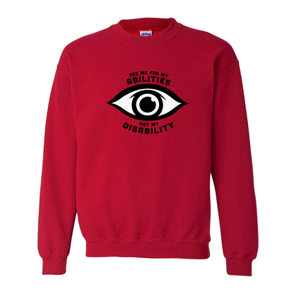 Red sweatshirt featuring an eye graphic and the text “See me for my abilities, not my disability.”